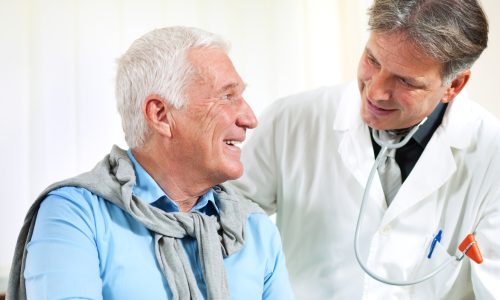 male doctor talking with his patient close up of a male doctor discussing with senior man